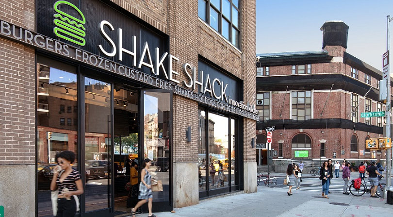 Shake Shack store on street corner. Image obtained from Hudson Square Properties